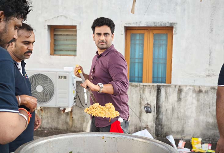 Glint Creatives team members serving meals with 
          compassion as part of their Glint Social Responsibility initiative